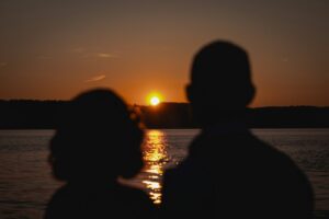 A couple of people standing next to each other